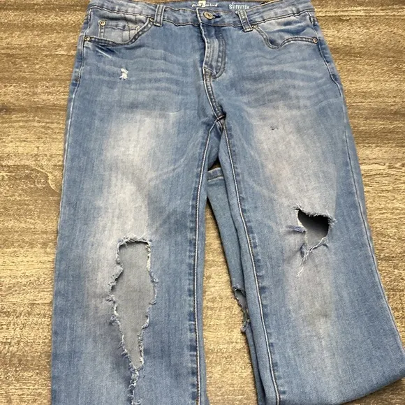 7 For all mankind jeans with Distressed around the Knee  area and back legs