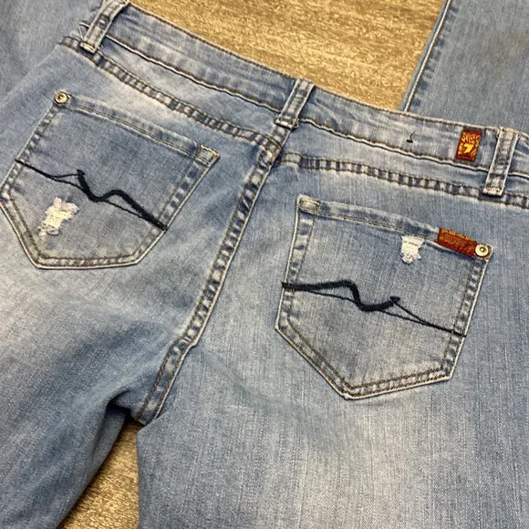 7 For all mankind jeans with Distressed around the Knee  area and back legs