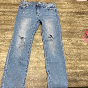 7 For all mankind jeans with Distressed around the Knee  area and back legs
