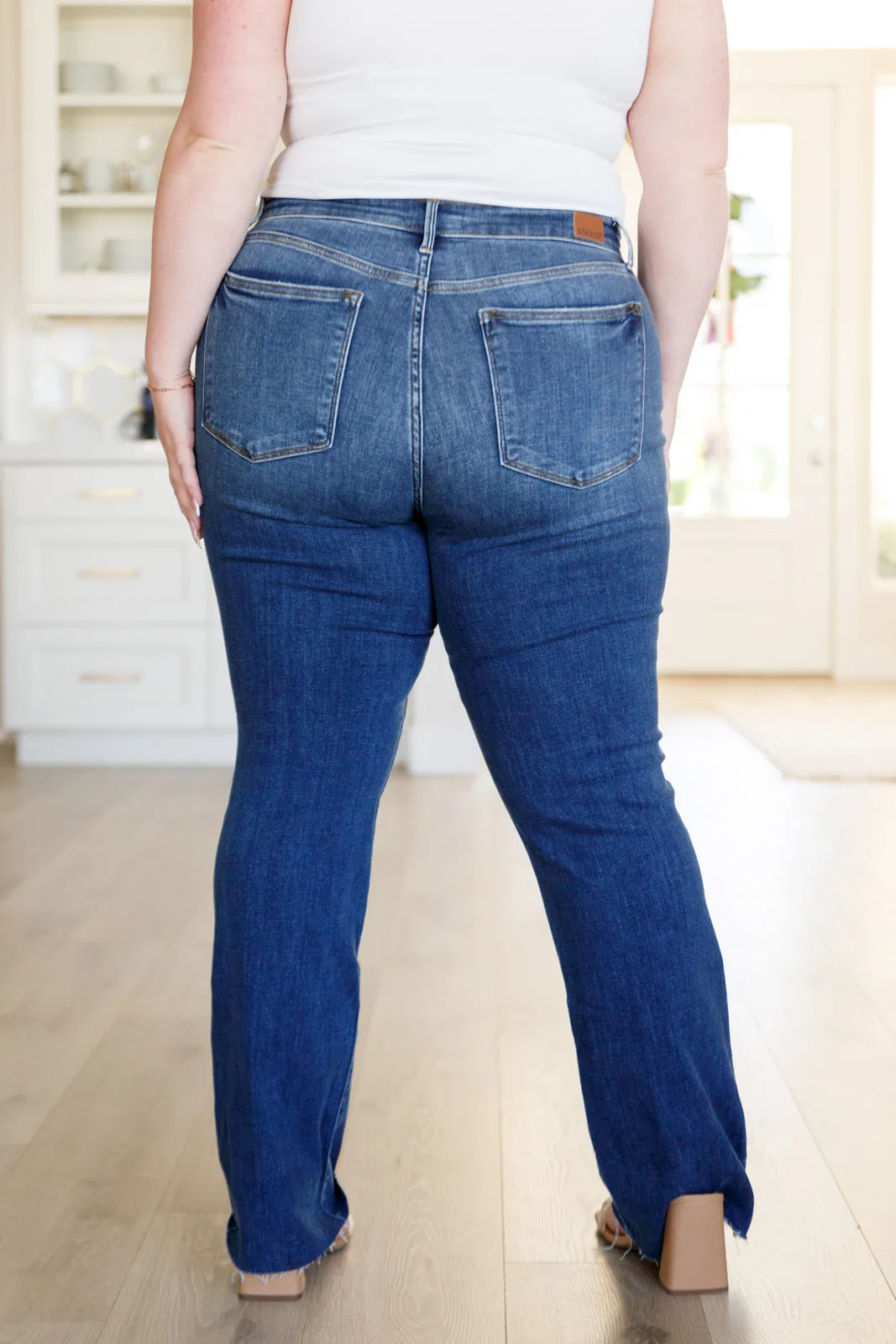 Josephine Mid Rise Raw Hem Bootcut Jeans by Judy Blue