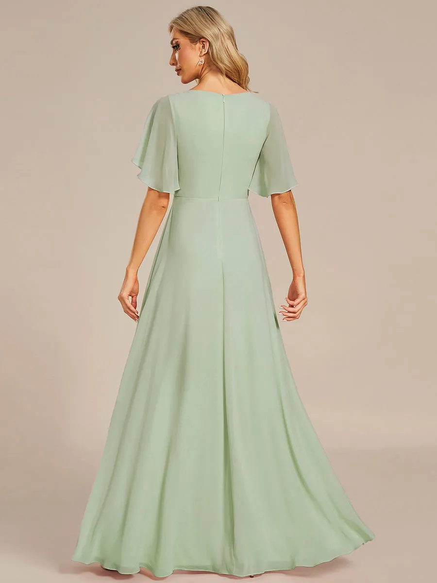 Robe de soirée élégante en mousseline de soie avec manches flottantes