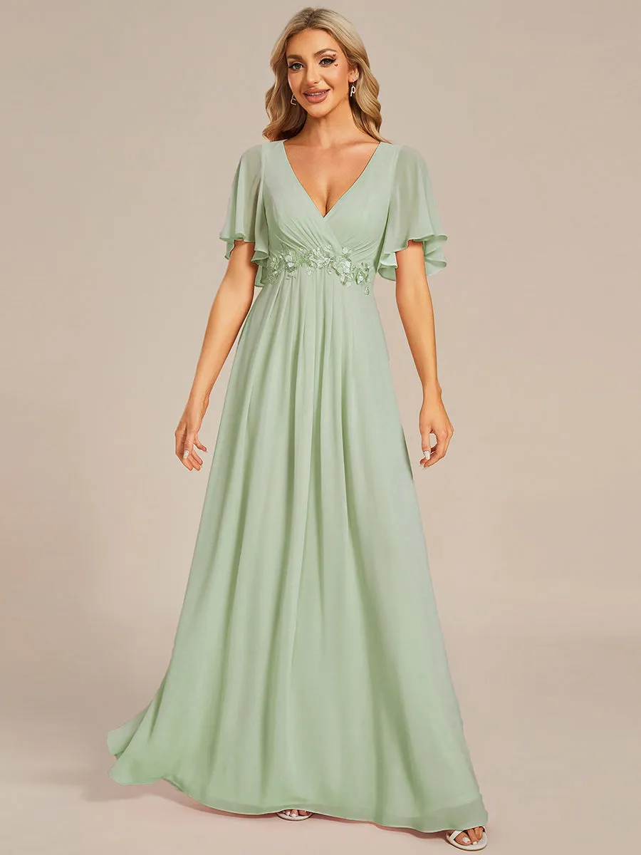 Robe de soirée élégante en mousseline de soie avec manches flottantes
