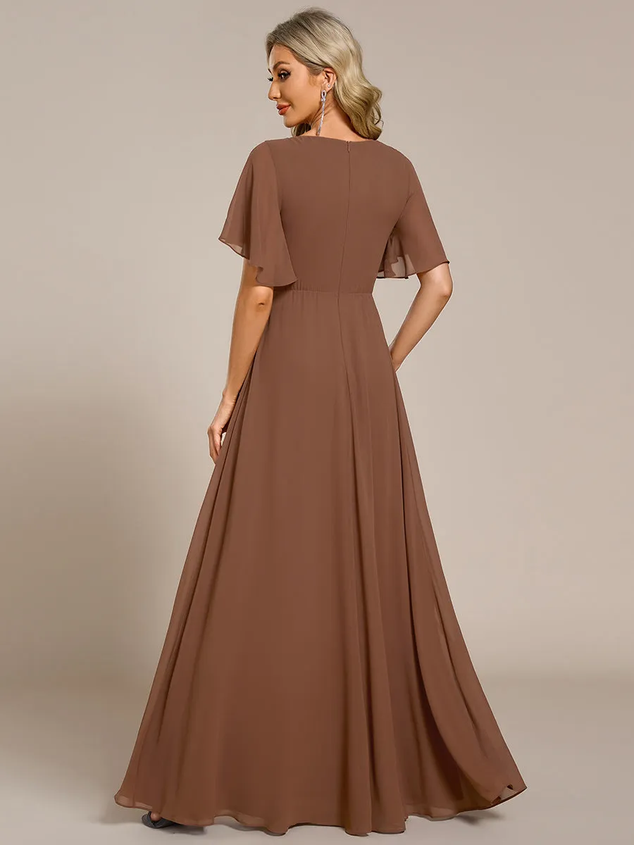 Robe de soirée élégante en mousseline de soie avec manches flottantes