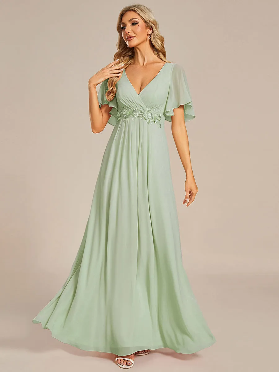 Robe de soirée élégante en mousseline de soie avec manches flottantes