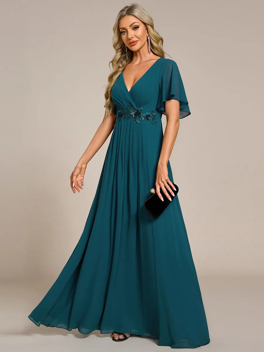 Robe de soirée élégante en mousseline de soie avec manches flottantes