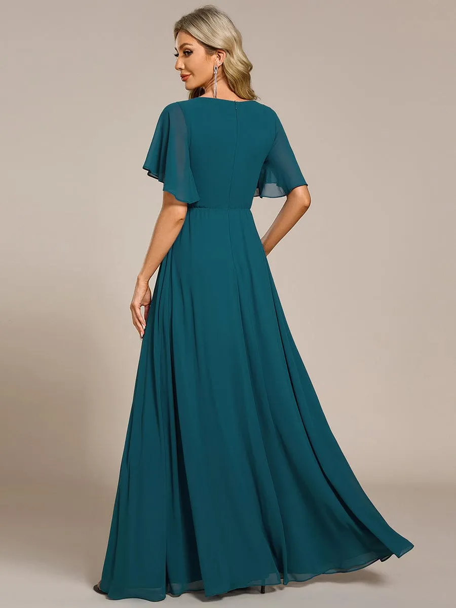 Robe de soirée élégante en mousseline de soie avec manches flottantes