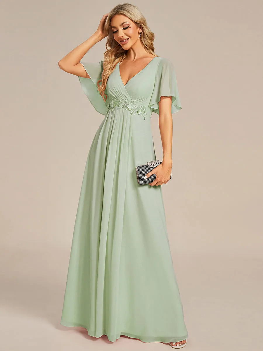 Robe de soirée élégante en mousseline de soie avec manches flottantes