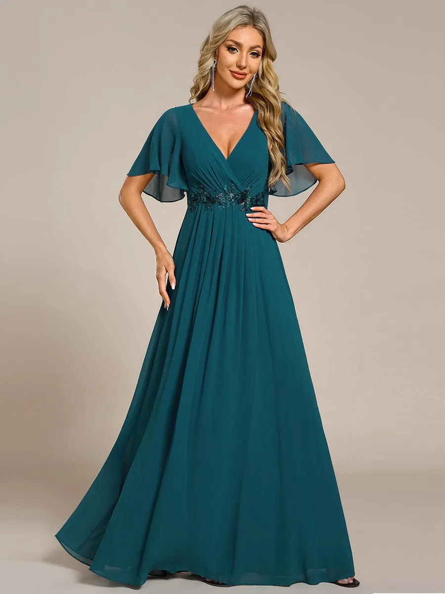 Robe de soirée élégante en mousseline de soie avec manches flottantes