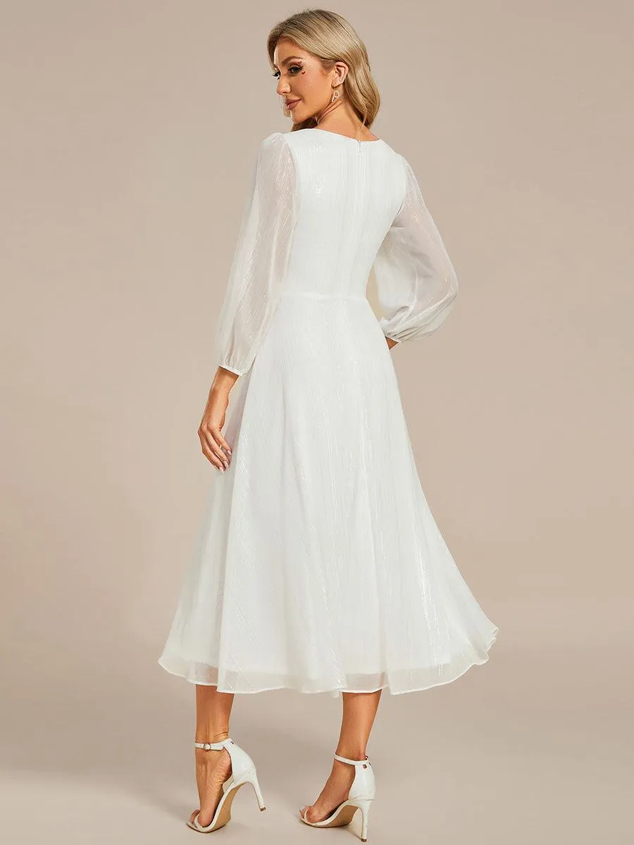 Robe de soirée trapèze scintillante à manches longues et col en V en mousseline de soie avec torsadé